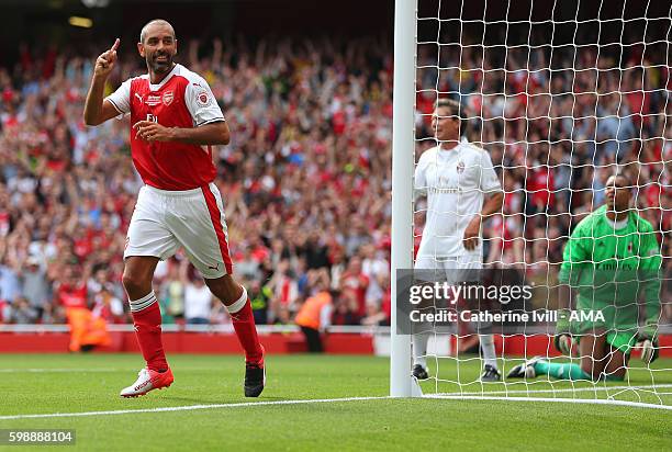 Robert Pires of Arsenal Legends celebrates after he scores a goal to make it 4-1 during the Arsenal Foundation Charity match between Arsenal Legends...