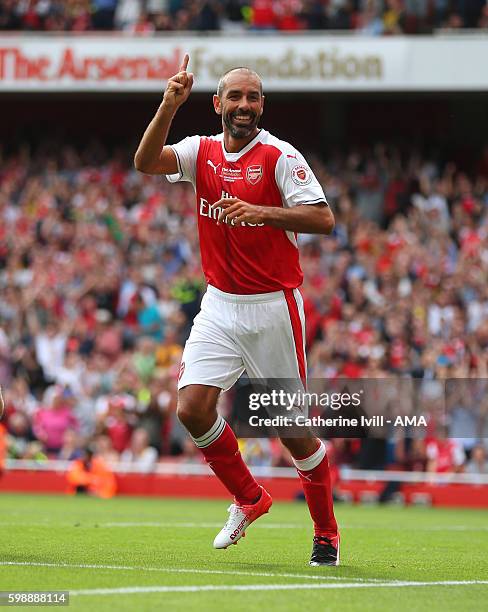 Robert Pires of Arsenal Legends celebrates after he scores a goal to make it 4-1 during the Arsenal Foundation Charity match between Arsenal Legends...