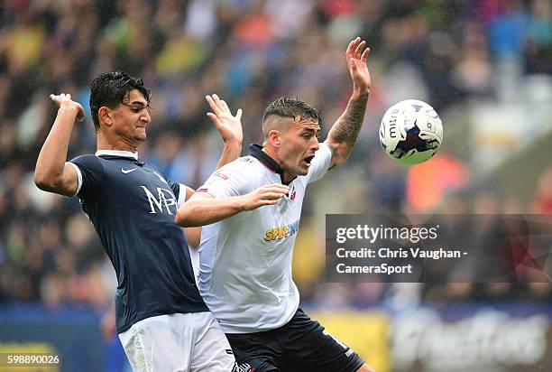 Bolton Wanderers' Gary Madine goes down inside the penalty area under pressure from Southend United's Harry Kyprianou but his appeals for a penalty...