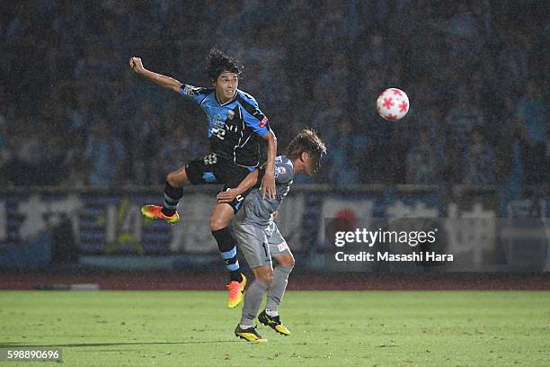 Yoshihiro Nakano of Kawasaki Frontale and Ken Hisatomi of Blaublitz Akita compete for the ball during the 96th Emperor's Cup first round match...