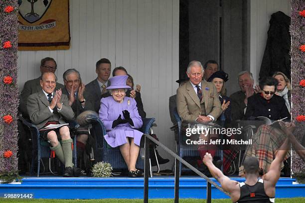 Prince Philip, Queen Elizabeth II, Prince Charles and Princess Anne watch performers at the Braemar Gathering on September 3, 2016 in Braemar,...