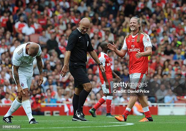 Emmanuel Petit of Arsenal Legends and Referee Howard Webb during the Arsenal Foundation Charity match between Arsenal Legends and Milan Glorie at...