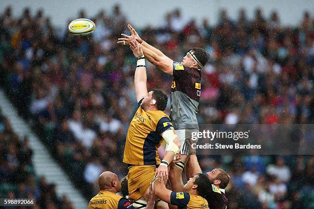 Jack Clifford of Harlequins wins a lineout ball from James Phillips of Bristol Rugby during the Aviva Premiership match between Harlequins and...