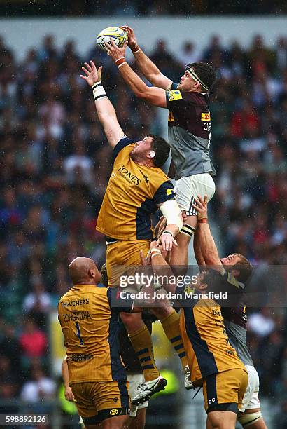 Jack Clifford of Harlequins wins a lineout ball from James Phillips of Bristol Rugby during the Aviva Premiership match between Harlequins and...