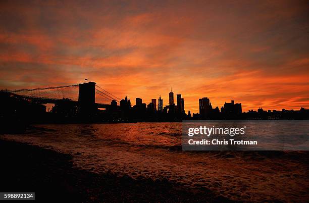 View of the Brooklyn Bridge, One World Trade Center and the New York City skyline are seen as the sun sets on Day Five of the 2016 US Open at the...