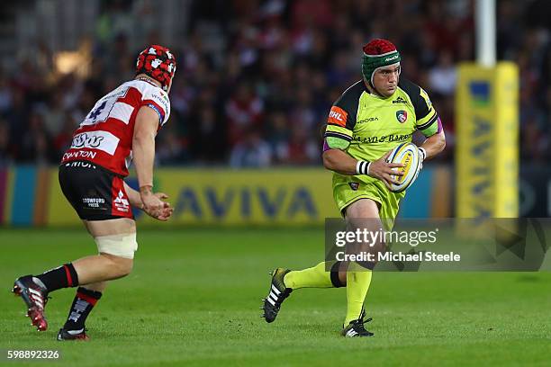 Marcos Ayerza of Leicester is tracked by Tom Savage of Gloucester during the Aviva Premiership match between Gloucester and Leicester Tigers at...