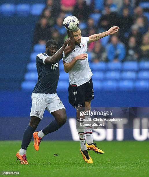 Bolton Wanderers' Mark Beevers vies for possession with Southend United's Jason Williams during the Sky Bet League One match between Bolton Wanderers...