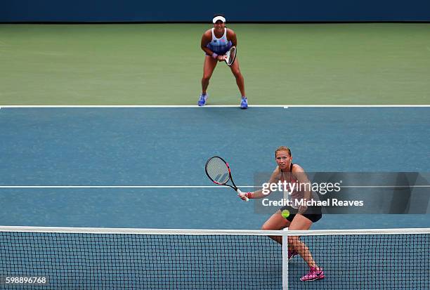 Michaella Krajicek of Netherlands and Heather Watson of the United Kingdom in action against Nao Hibino of Japan and Nicole Gibbs of the United...