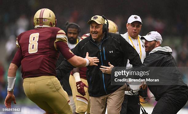 Dublin , Ireland - 3 September 2016; Boston College head coach Steve Addazio , celebrates with Quarterback Patrick Towles of Boston College Eagles...