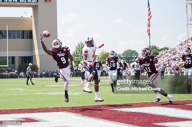 Defensive back Jamoral Graham of the Mississippi State Bulldogs attempts to intercept a pass intended for wide receiver Jordan McCray of the South...