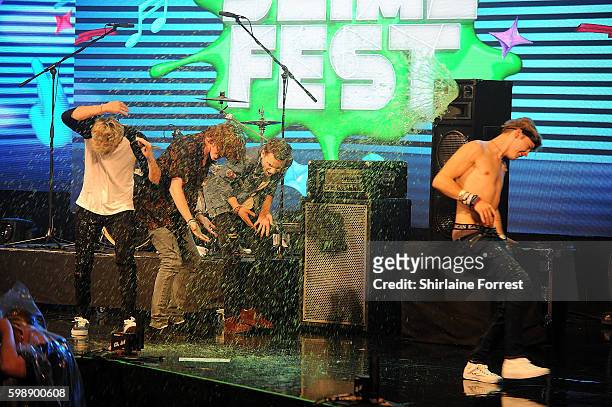 The Tide are slimed on stage during the first UK Nickelodeon SLIMEFEST at the Empress Ballroom on September 3, 2016 in Blackpool, England.