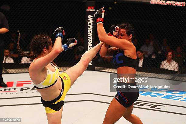Veronica Macedo of Venezuela kicks facing Ashlee Evans-Smith of the USA compete in their Womens Bantamweight Bout during the UFC Fight Night held at...