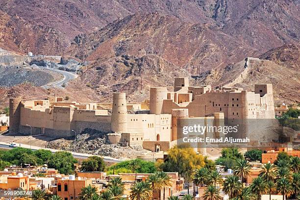 bahla fort, bahla, oman - festung stock-fotos und bilder