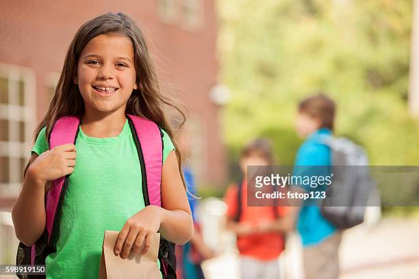 elementary-age children on school campus. - lunch bag stock pictures, royalty-free photos & images
