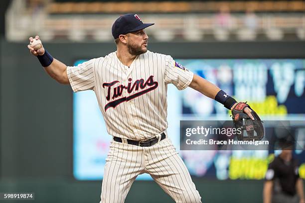 Trevor Plouffe of the Minnesota Twins throws against the Houston Astros on August 11, 2016 at Target Field in Minneapolis, Minnesota. The Astros...