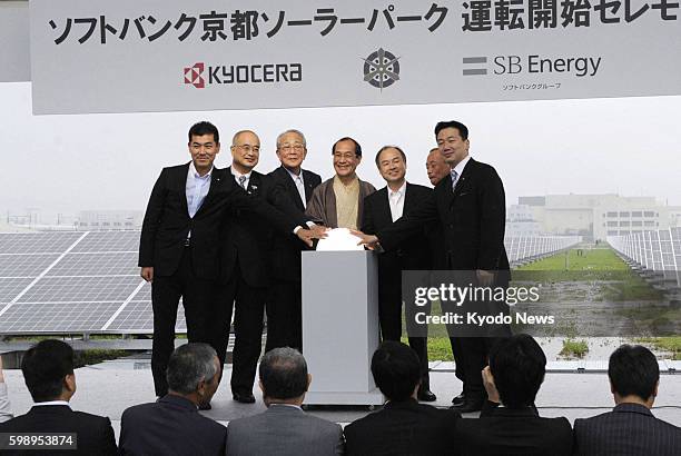 C, Japan - Softbank Corp. Chairman and Chief Executive Officer Masayoshi Son , Kyoto Mayor Daisaku Kadokawa and others gather at a ceremony in the...