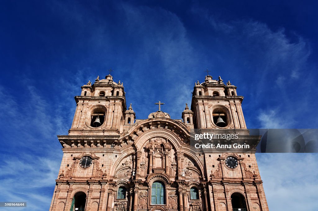 Low angle view of Iglesias de la Compania de Jesus facade on spring afternoon in Plaza de Armas, Cusco, Peru