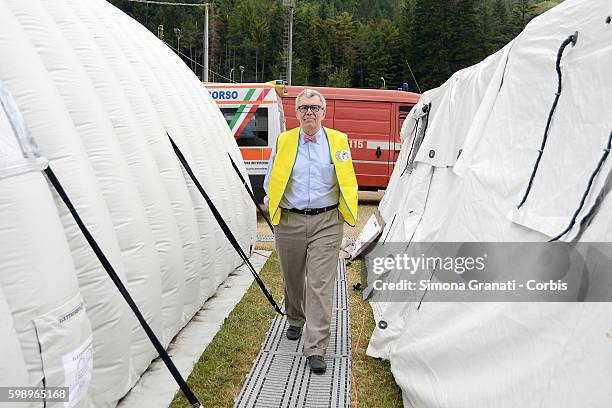 Volunteer doctor Nunzio Borelli walks through the tent camp erected for earthquake victims on August 31, 2016 in Arquata del Tronto, Italy. The...