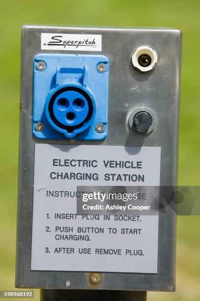 electric car charging point at bedzed - bedzed stock pictures, royalty-free photos & images