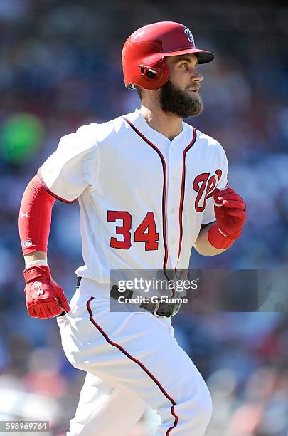 Bryce Harper of the Washington Nationals runs towards first base against the Colorado Rockies at Nationals Park on August 28, 2016 in Washington, DC.