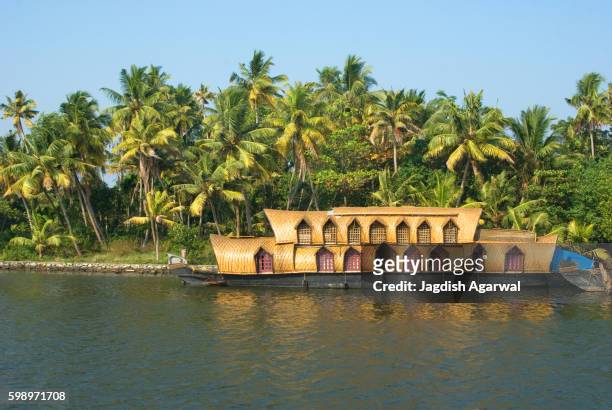 houseboat on the bank of ashtamudi river, kollam, alleppey, kerala, india - house boat stock pictures, royalty-free photos & images