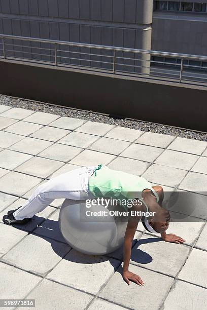 woman using fitness ball - oliver eltinger stock pictures, royalty-free photos & images
