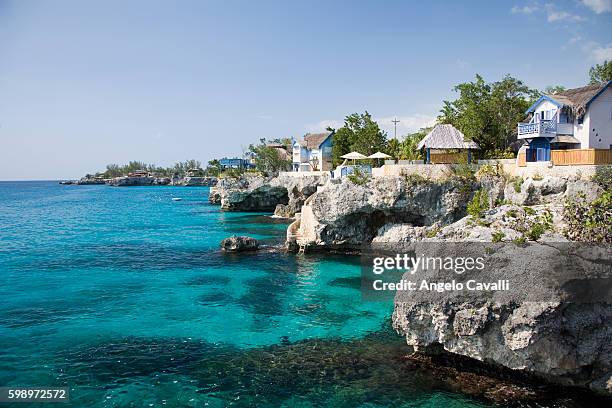 houses by the sea - jamaican stock pictures, royalty-free photos & images