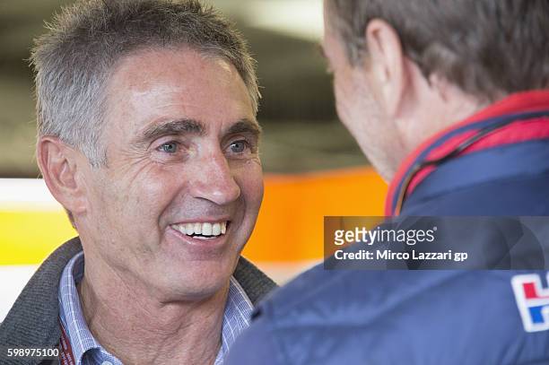 Michael Doohan of Australia looks on in box during the MotoGp Of Great Britain qualifying practice at Silverstone Circuit on September 3, 2016 in...