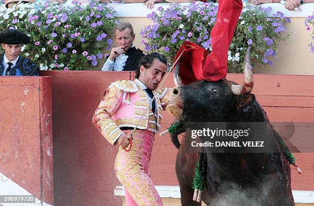 Spanish matador Yvan Fandino performs a pass to a bull during the Atlantique corrida in Bayonne, southern France, on September 3, 2016. / AFP /...