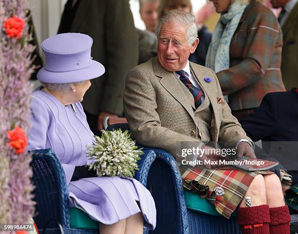 Queen Elizabeth II and Prince Charles, Prince of Wales attend the 2016 Braemar Highland Gathering at The Princess Royal and Duke of Fife Memorial...