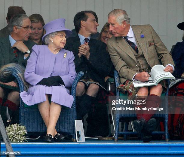 Queen Elizabeth II and Prince Charles, Prince of Wales attend the 2016 Braemar Highland Gathering at The Princess Royal and Duke of Fife Memorial...