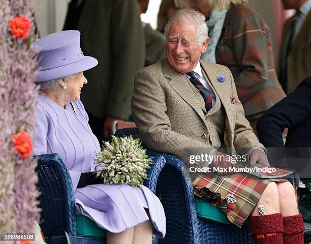 Queen Elizabeth II and Prince Charles, Prince of Wales attend the 2016 Braemar Highland Gathering at The Princess Royal and Duke of Fife Memorial...