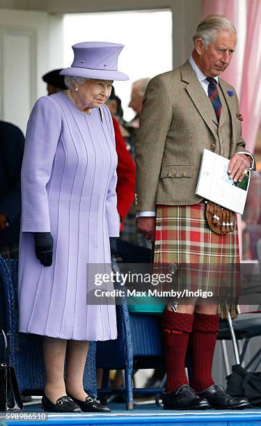 Queen Elizabeth II and Prince Charles, Prince of Wales attend the 2016 Braemar Highland Gathering at The Princess Royal and Duke of Fife Memorial...