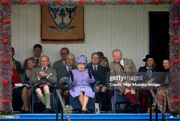 Prince Philip, Duke of Edinburgh, Queen Elizabeth II and Prince Charles, Prince of Wales attend the 2016 Braemar Highland Gathering at The Princess...