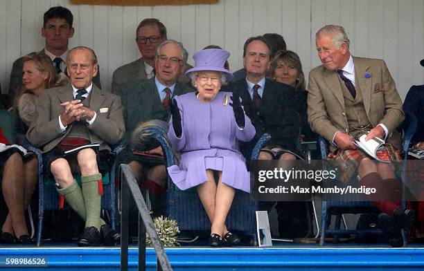 Prince Philip, Duke of Edinburgh, Queen Elizabeth II and Prince Charles, Prince of Wales attend the 2016 Braemar Highland Gathering at The Princess...