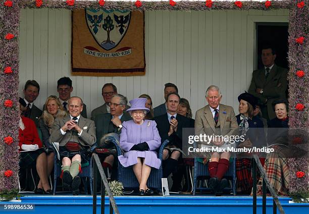 Prince Philip, Duke of Edinburgh, Queen Elizabeth II and Prince Charles, Prince of Wales attend the 2016 Braemar Highland Gathering at The Princess...