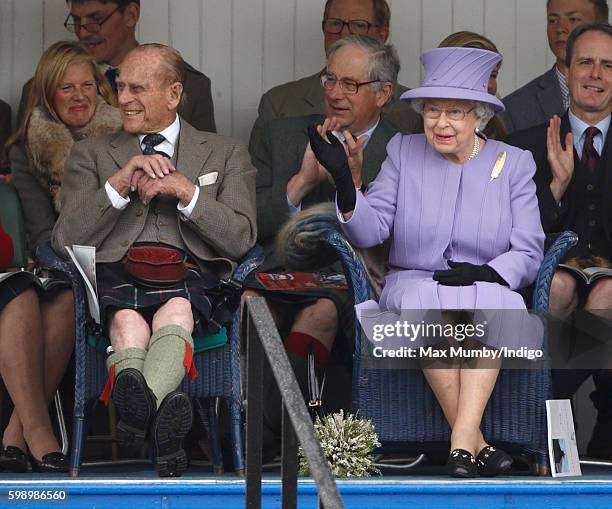 Prince Philip, Duke of Edinburgh and Queen Elizabeth II attend the 2016 Braemar Highland Gathering at The Princess Royal and Duke of Fife Memorial...