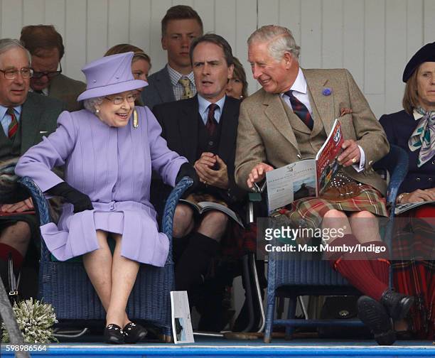 Queen Elizabeth II and Prince Charles, Prince of Wales attend the 2016 Braemar Highland Gathering at The Princess Royal and Duke of Fife Memorial...