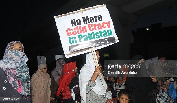 Supporters of Pakistani preacher Muhammad Tahir-ul-Qadri leader of Pakistan Awami Tehreek gather during an anti-government protest in Rawalpindi,...