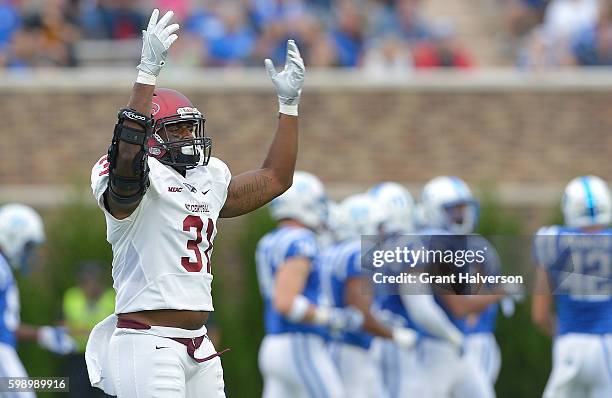 Jarrett McCarter of the North Carolina Central Eagles pumps up the visiting crowd during their game against the Duke Blue Devils at Wallace Wade...
