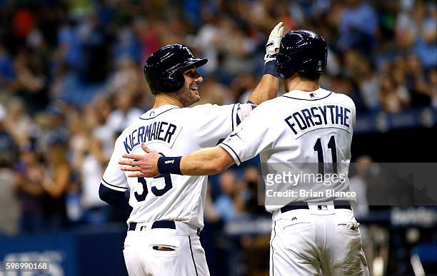 Kevin Kiermaier of the Tampa Bay Rays celebrates his two-run home run with teammate Logan Forsythe during the seventh inning of a game against the...