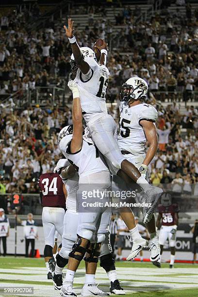 Justin Holman of the UCF Knights celebrates a touchdown during a NCAA football game against the South Carolina State Bulldogs at Bright House...