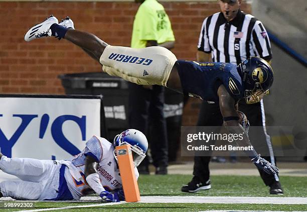 Running back Wesley Fields of the Georgia Southern Eagles is sent airborne into the endzone by cornerback Darrell Bonner of the Savannah State Tigers...