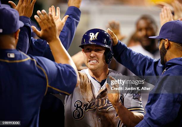 Jake Elmore of the Milwaukee Brewers celebrates after scoring on a two RBI single in the eighth inning during the game against the Pittsburgh Pirates...