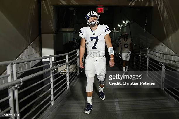 Quarterback Taysom Hill of the Brigham Young Cougars walks out onto the field before the college football game against the Arizona Wildcats at...