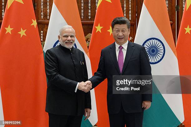 Indian Prime Minister Narendra Modi shakes hands with Chinese President Xi Jinping at the West Lake State Guest House on September 4, 2016 in...