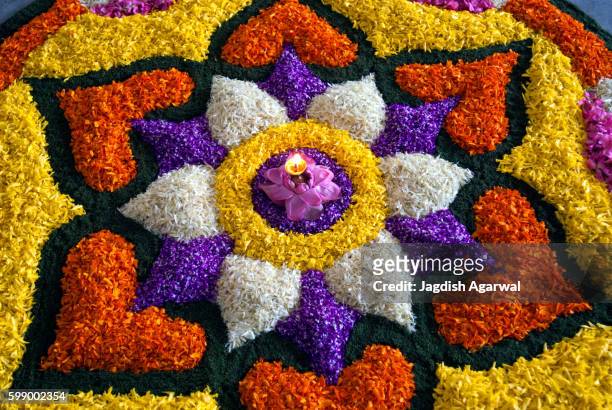 flower decoration for onam festival, kerala, india - rangoli stock-fotos und bilder