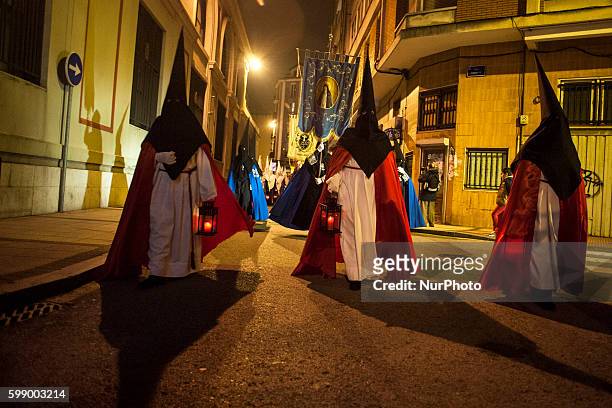 Nazarenes through the streets of Santander during nighttime procession of prayer celebrated on Easter Monday. SANTANDER, Spain on March 21, 2016....