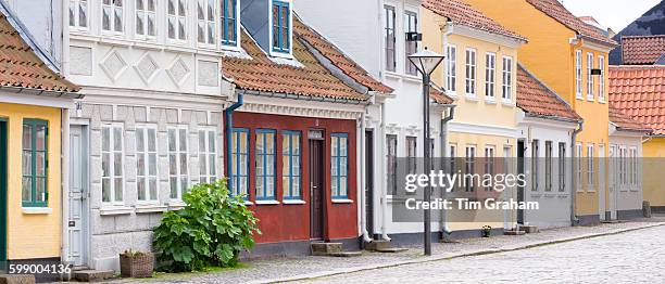 Painted houses in Ramsherred cobbled street in old town in Odense on Funen Island, Denmark