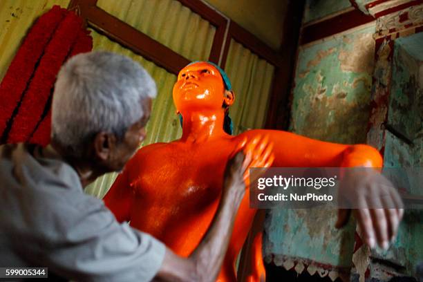 Last day of the bangle month the people of Munshiganj district Bangladesh do a warship of Hindu God Shiva praying for free from disease. In that day...